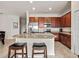 Kitchen island with granite countertop and breakfast bar seating at 16904 Vardon Ter # 301, Bradenton, FL 34211