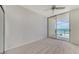 Comfortable bedroom with sliding glass doors leading to a beachfront balcony at 1800 Benjamin Franklin Dr # A405, Sarasota, FL 34236
