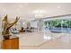 Spacious lobby featuring comfortable seating, modern decor, and an ocean view through glass doors at 1800 Benjamin Franklin Dr # A405, Sarasota, FL 34236
