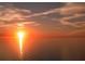 Vibrant sunset over a calm ocean view with orange hues reflecting on the water at 1800 Benjamin Franklin Dr # A405, Sarasota, FL 34236