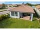 Covered patio with brick pavers and comfortable seating, overlooking a well-manicured lawn at 1901 6Th E St, Palmetto, FL 34221