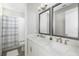 Double vanity bathroom with a view into the shower and tub at 1901 6Th E St, Palmetto, FL 34221