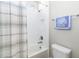 Bathroom with bathtub, shower, and neutral-toned tile at 1901 6Th E St, Palmetto, FL 34221