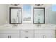 Double vanity bathroom with modern fixtures and large mirrors at 1901 6Th E St, Palmetto, FL 34221