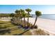 Relax and enjoy the community's private beach, complete with palm trees and sandy shoreline at 1901 6Th E St, Palmetto, FL 34221