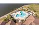 Community pool with a spa and lounge area, overlooking the water at 1901 6Th E St, Palmetto, FL 34221