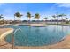Resort-style pool with palm trees and lounge chairs at 1901 6Th E St, Palmetto, FL 34221