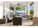 Relaxing covered patio overlooking waterfront with seating area at 1901 6Th E St, Palmetto, FL 34221