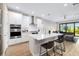 Modern kitchen with island, stainless steel appliances, and white cabinetry at 1901 6Th E St, Palmetto, FL 34221
