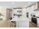 Spacious kitchen with large island, stainless steel appliances, and white cabinets at 1901 6Th E St, Palmetto, FL 34221