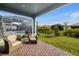 Relaxing patio with seating area overlooking the pool and backyard at 1901 6Th E St, Palmetto, FL 34221
