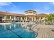 Community pool and clubhouse with seating areas at 1901 6Th E St, Palmetto, FL 34221