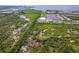 Aerial view of waterfront property with lush vegetation at 1964 Hawks View Dr, Ruskin, FL 33570