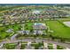 Aerial view of community with pool and playground at 1964 Hawks View Dr, Ruskin, FL 33570