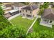Aerial view of house featuring backyard, solar panels, and surrounding homes at 1964 Hawks View Dr, Ruskin, FL 33570