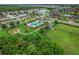 Aerial view of community amenities including pool, playground, and green space at 1964 Hawks View Dr, Ruskin, FL 33570