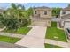Two-story house, two-car garage, and neatly landscaped yard at 1964 Hawks View Dr, Ruskin, FL 33570