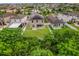 Aerial view showcasing a house with solar panels and a spacious backyard at 1964 Hawks View Dr, Ruskin, FL 33570
