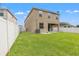 Large backyard with a grassy lawn and privacy fence at 1964 Hawks View Dr, Ruskin, FL 33570