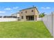 Spacious backyard with a large grassy area at 1964 Hawks View Dr, Ruskin, FL 33570