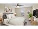 Charming bedroom with a queen bed, nightstands, and a TV at 1964 Hawks View Dr, Ruskin, FL 33570