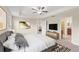 Bright bedroom with king-size bed and ensuite bathroom access at 1964 Hawks View Dr, Ruskin, FL 33570