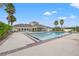 Inviting community pool with lounge area and palm trees at 1964 Hawks View Dr, Ruskin, FL 33570