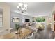 Bright dining room with hardwood floors and modern light fixture at 1964 Hawks View Dr, Ruskin, FL 33570