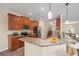 Spacious kitchen with granite countertops, stainless steel appliances, and wood cabinets at 1964 Hawks View Dr, Ruskin, FL 33570