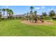 playground with climbing structures and a slide at 1964 Hawks View Dr, Ruskin, FL 33570
