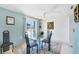 Dining area with a glass table and a floral rug at 2271 Sandlewood Dr, Venice, FL 34293