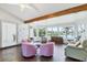 Bright living area with large windows showcasing waterfront views and comfortable seating at 2271 Sandlewood Dr, Venice, FL 34293