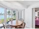 Sunroom filled with light and overlooking water at 2271 Sandlewood Dr, Venice, FL 34293