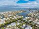 An aerial view of the property showing its location on a canal and proximity to the ocean at 245 Willow Ave, Anna Maria, FL 34216