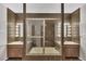 Unique bathroom with dual vanities, shower tub combo and mosaic tile walls at 2605 Desoto Rd, Sarasota, FL 34234