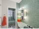 Stylish bathroom with unique textured walls, vintage fixtures, and shower at 2605 Desoto Rd, Sarasota, FL 34234