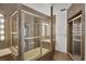 Unique bathroom with vanities, glass shower, and brown mosaic tile at 2605 Desoto Rd, Sarasota, FL 34234