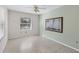 Neutral bedroom with polished floors and light-filtering window at 2605 Desoto Rd, Sarasota, FL 34234