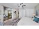 Bright bedroom with ceiling fan, closet, and view to dining area at 2605 Desoto Rd, Sarasota, FL 34234