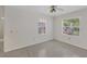 Bright bedroom with two large windows and polished floors at 2605 Desoto Rd, Sarasota, FL 34234