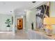 Light and bright foyer with terrazzo flooring and an eclectic art collection at 2605 Desoto Rd, Sarasota, FL 34234