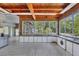 Bright kitchen featuring white cabinets and large windows with a view of the back yard at 2605 Desoto Rd, Sarasota, FL 34234
