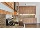 Functional kitchen featuring tile countertops and wood cabinetry at 2605 Desoto Rd, Sarasota, FL 34234