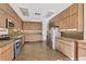 Spacious kitchen featuring ample storage space with stainless steel appliances, perfect for cooking at 2605 Desoto Rd, Sarasota, FL 34234