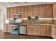 Traditional kitchen with wood cabinets, mosaic backsplash, and stainless steel appliances at 2605 Desoto Rd, Sarasota, FL 34234