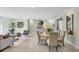 Open-plan living and dining room with modern furniture, a light-filled space perfect for relaxing at 2605 Desoto Rd, Sarasota, FL 34234