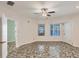 Spacious living room with large windows, tile flooring, and neutral color palette at 2605 Desoto Rd, Sarasota, FL 34234