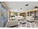 Spacious living room with cozy seating, ample natural light, and built-in bookcases at 2605 Desoto Rd, Sarasota, FL 34234