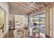 Bright sunroom featuring beamed ceilings, and access to the bedroom and pool areas at 2605 Desoto Rd, Sarasota, FL 34234