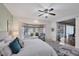 Airy main bedroom includes a ceiling fan, pool views, and sliding doors at 2605 Desoto Rd, Sarasota, FL 34234